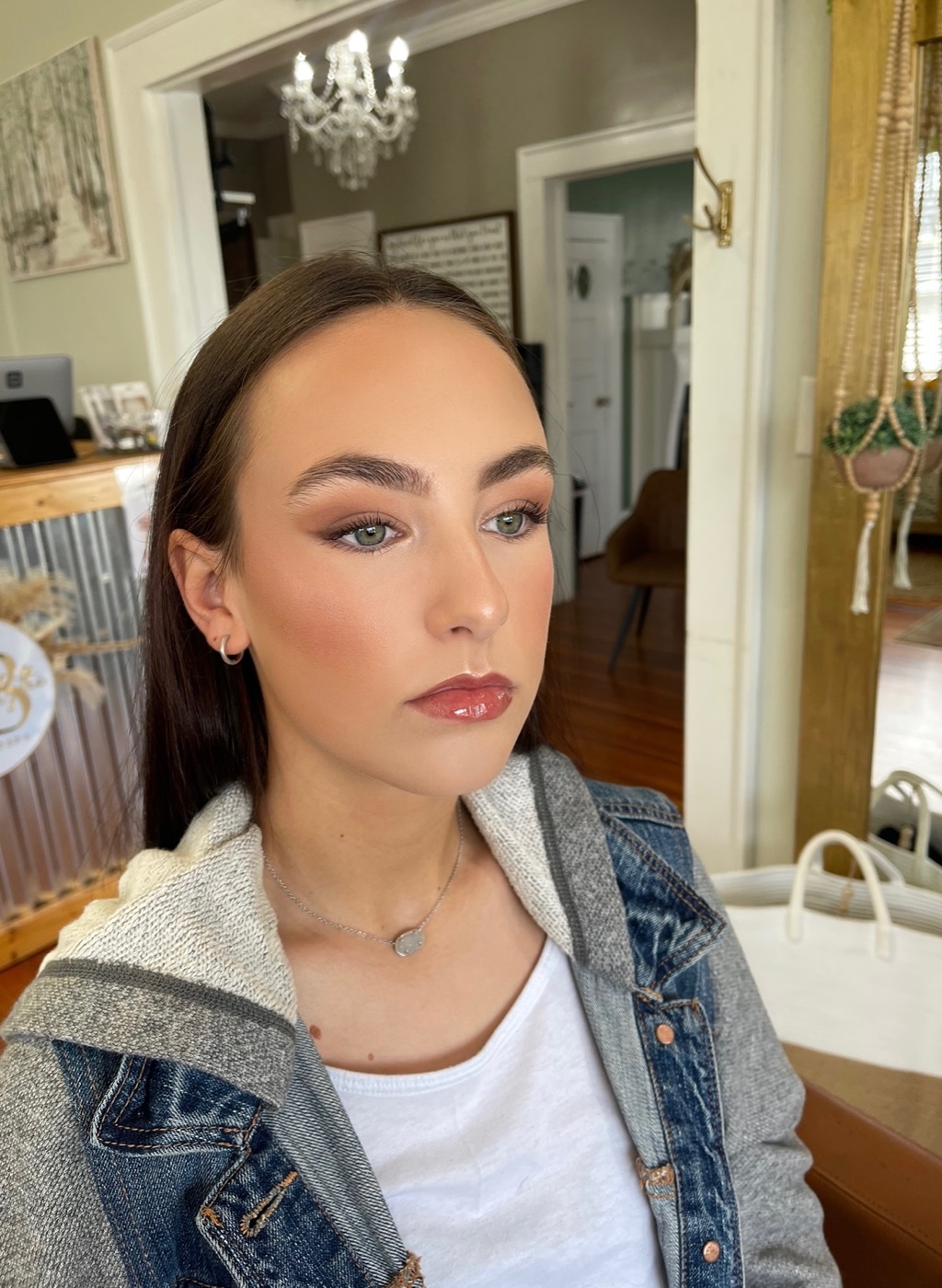 Bronzed glam makeup with a brown smoky eye and glossy lip, by Bailee